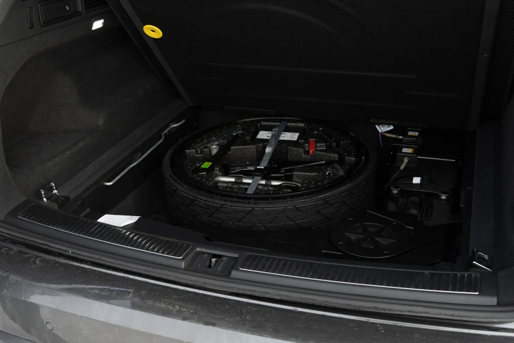 Spare tyre and tools ready at the roadside